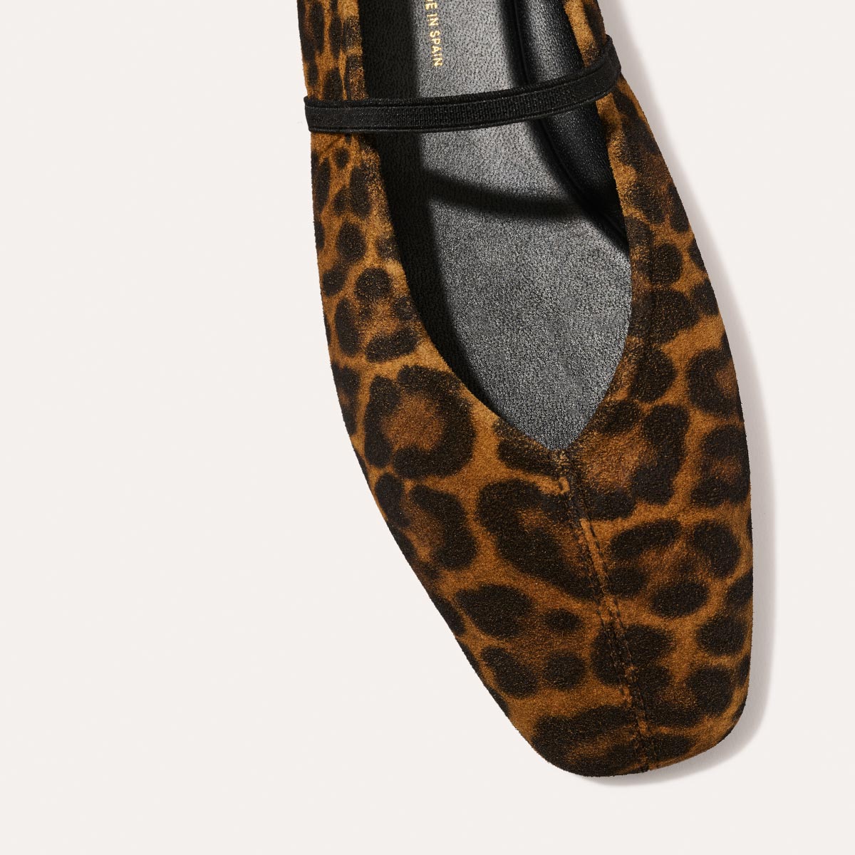 The Phoebe in luxe Leopard Suede, a ballet flat with a squared off toe, high vamp and elastic Mary Jane strap.