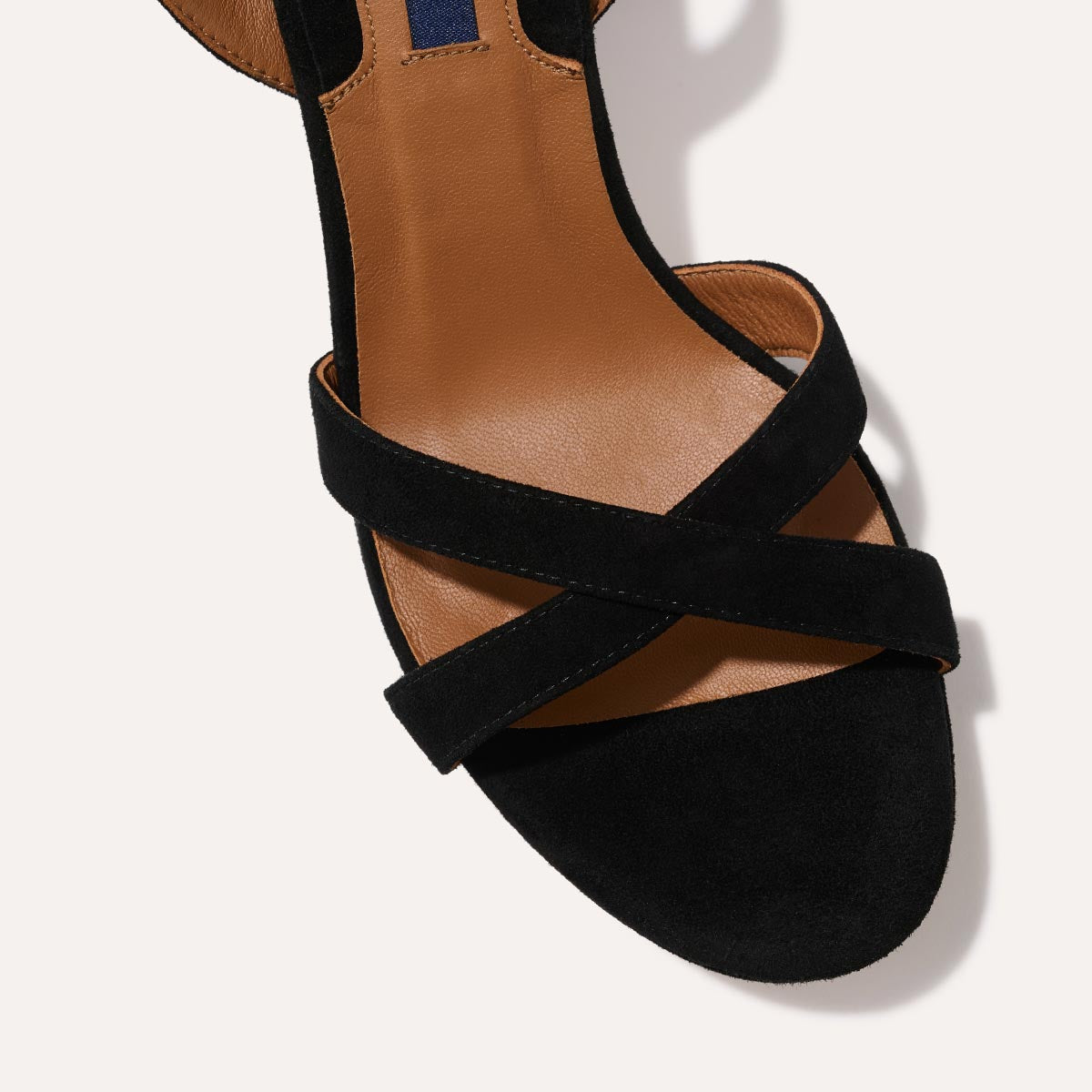 The Platform Sandal in Black Suede, featuring a sleek ankle strap, perfectly placed straps across the toes and a comfortable 3.5-inch block heel.