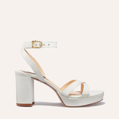 The Platform Sandal in Ivory Nappa, featuring a sleek ankle strap, perfectly placed straps across the toes and a comfortable 3.5-inch block heel.