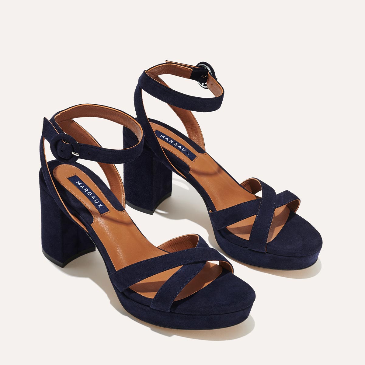 Margaux's classic and comfortable City Sandal in navy blue Italian suede with crossed straps and a walkable block heel