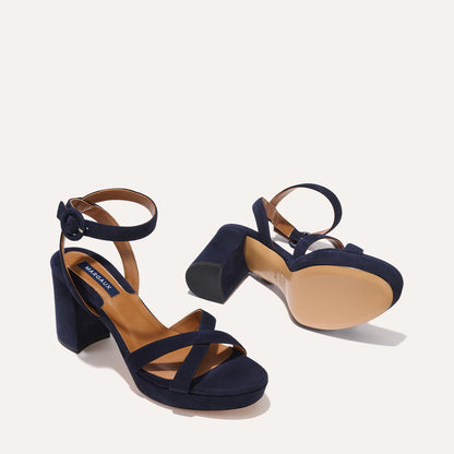 The Platform Sandal in Midnight Suede, featuring a sleek ankle strap, perfectly placed straps across the toes and a comfortable 3.5-inch block heel.