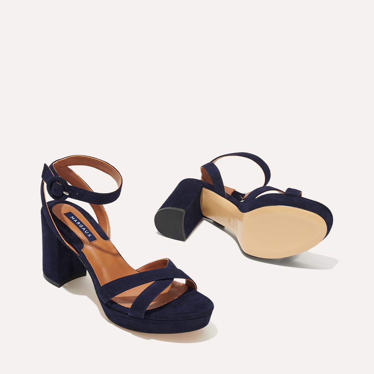 Margaux's classic and comfortable City Sandal in navy blue Italian suede with crossed straps and a walkable block heel