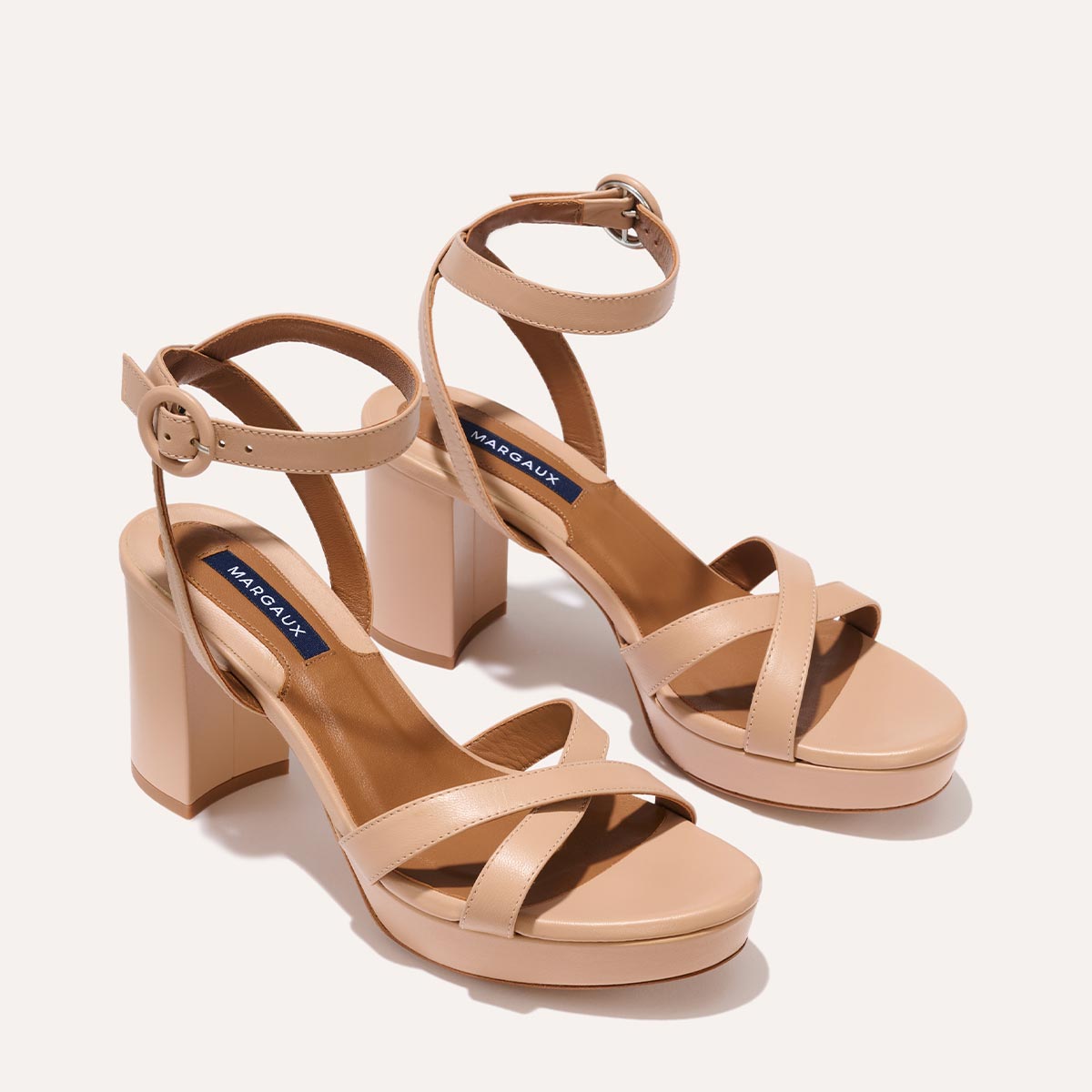 The Platform Sandal in Rose Nappa, featuring a sleek ankle strap, perfectly placed straps across the toes and a comfortable 3.5-inch block heel.