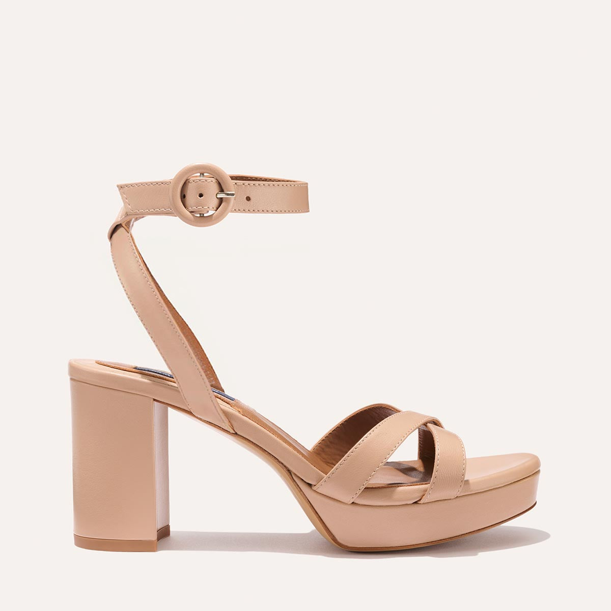 The Platform Sandal in Rose Nappa, featuring a sleek ankle strap, perfectly placed straps across the toes and a comfortable 3.5-inch block heel.