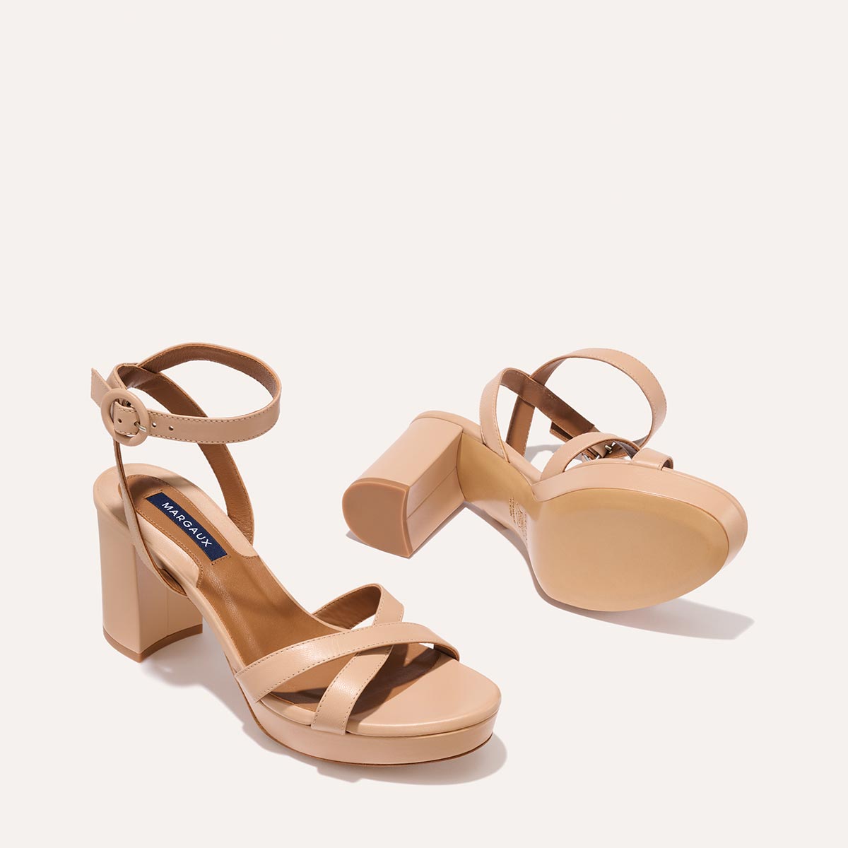 The Platform Sandal in Rose Nappa, featuring a sleek ankle strap, perfectly placed straps across the toes and a comfortable 3.5-inch block heel.