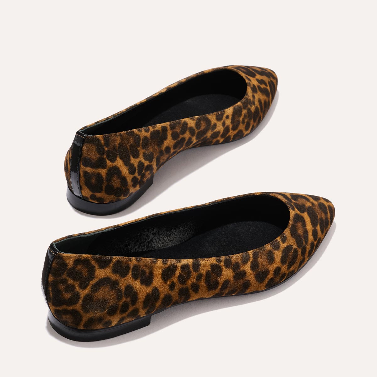 The Pointe in leopard printed suede, a classic and comfortable ballet flat featuring a refined pointed toe design.