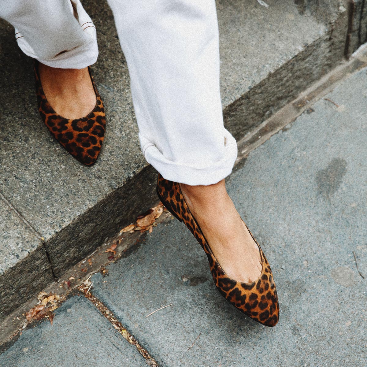 The Pointe in leopard printed suede, a classic and comfortable ballet flat featuring a refined pointed toe design.