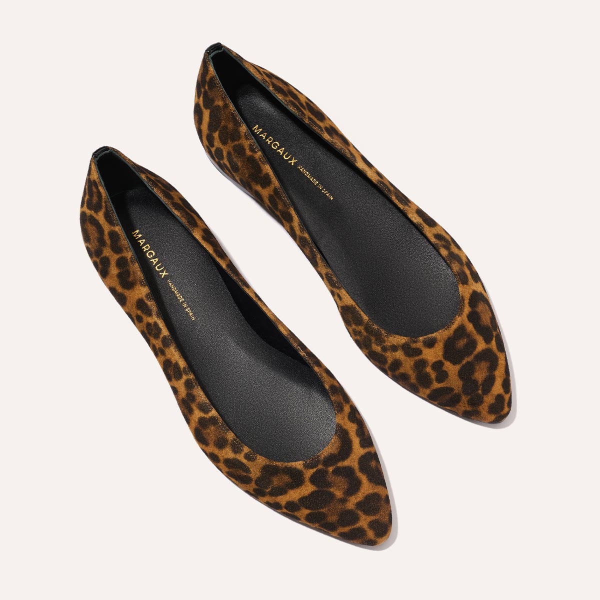 The Pointe in leopard printed suede, a classic and comfortable ballet flat featuring a refined pointed toe design.