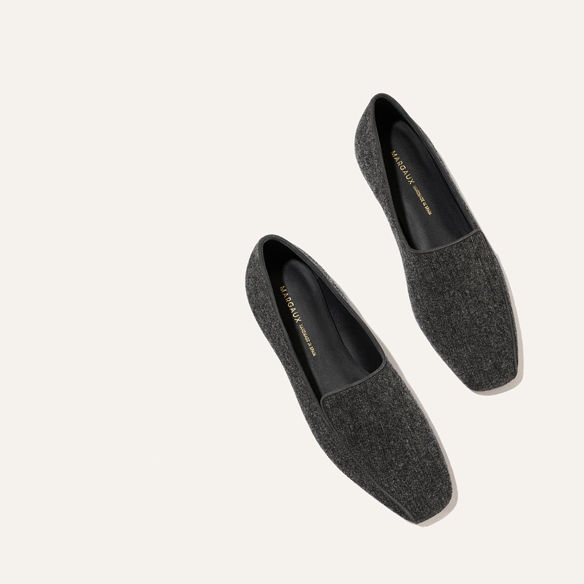 A pair of The Portia Loafer - Grey Flannel shoes with square toes.
