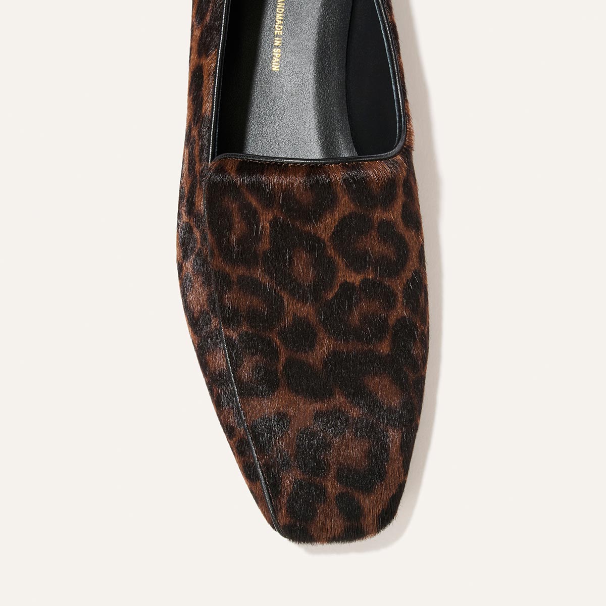 The Portia Loafer - Chocolate Leopard Haircalf, a square-toe loafer in a brown and black leopard print pattern.