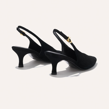 The Prado Sling - Black Suede by margaux-development: black slingback heels with pointed toes, mid-height heels, and gold buckle straps, shown against a plain light background.