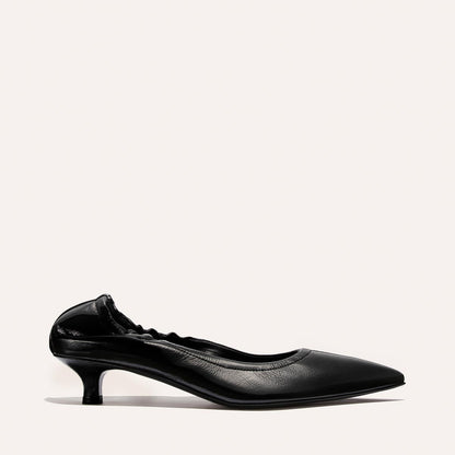 The Roma 40 by Margaux: a single black crinkle patent kitten-heel shoe with a pointed toe and ruched elastic heel detail, showcased on a plain light background.