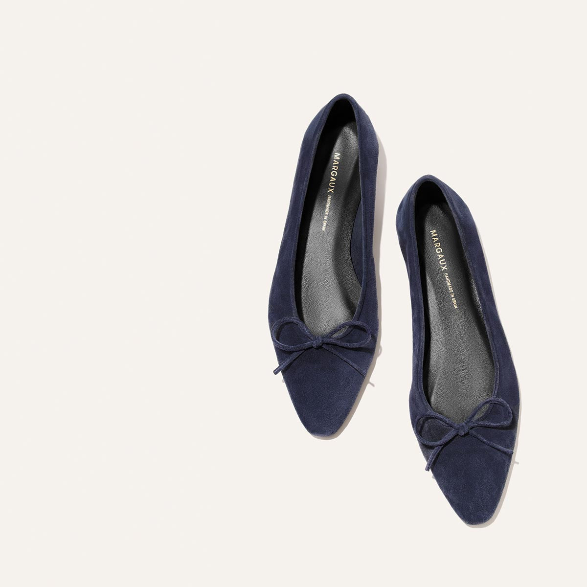 The Salamanca - Vintage Navy Suede pointed-toe flats in buttery soft navy blue suede, featuring a small bow detail at the toe.