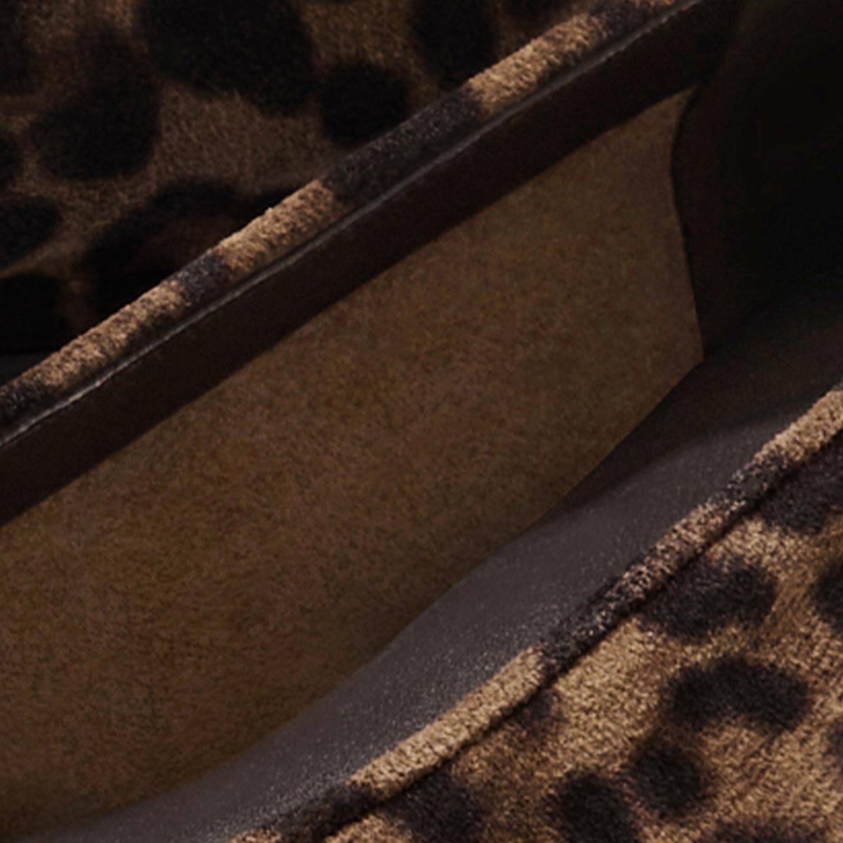 Close-up of The Salamanca - Brown Leopard Suede by Margaux, showing brown suede with black leopard print and visible stitching.