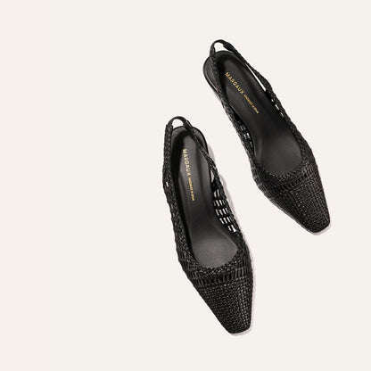 The Sofia Sling - Black Woven Leather by Margaux, a pair of pointed-toe slingback flats, shown on a light beige background.