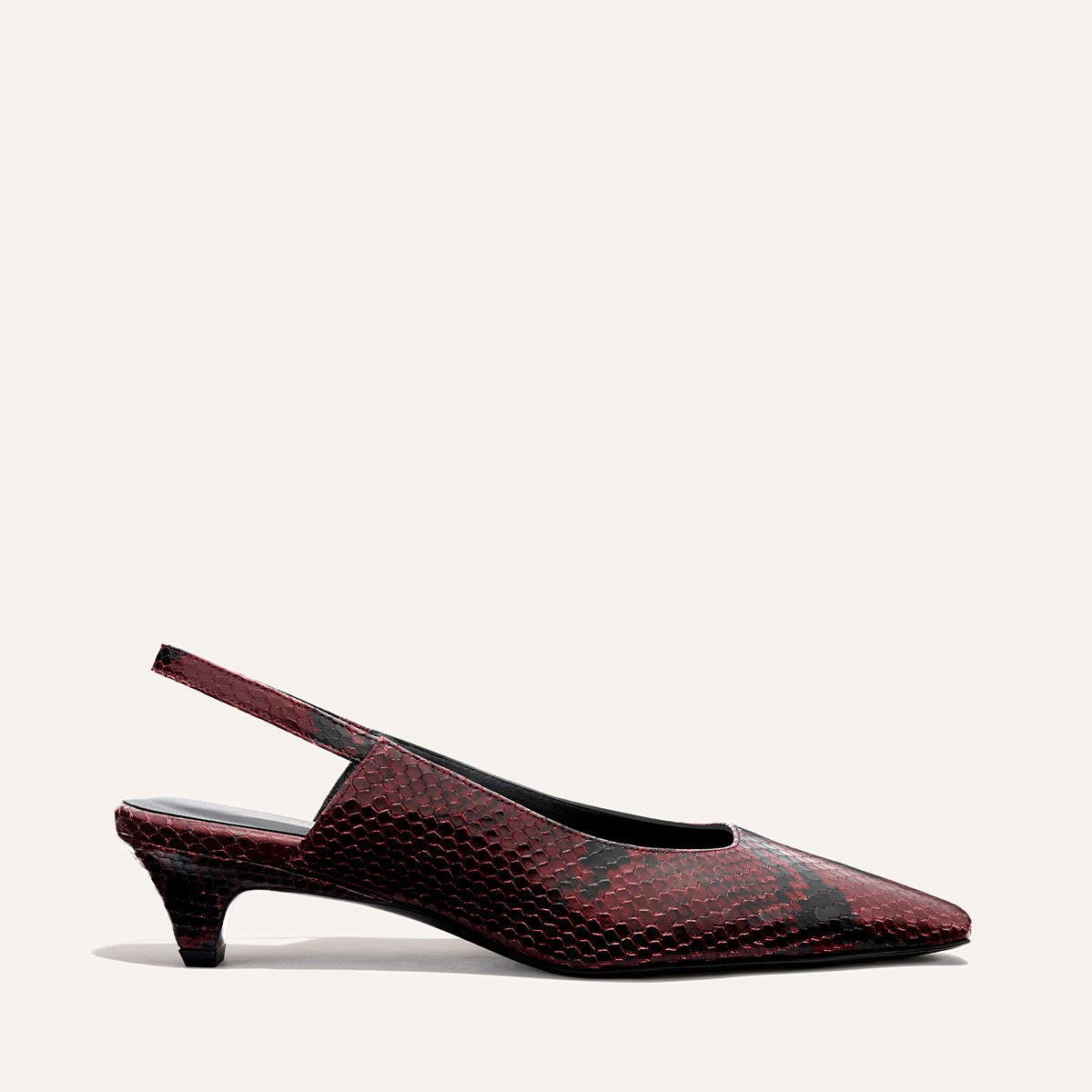 The Sofia Sling - Burgundy Python Embossed by Margaux is a maroon and black snakeskin-patterned pointed-toe slingback kitten heel, shown against a plain light background.