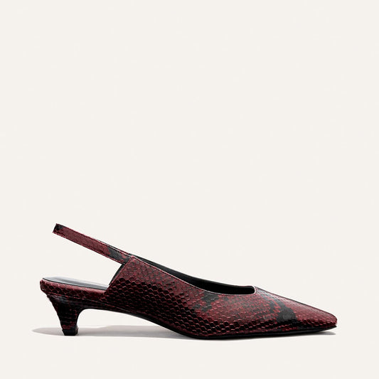 The Sofia Sling - Burgundy Python Embossed by Margaux is a maroon and black snakeskin-patterned pointed-toe slingback kitten heel, shown against a plain light background.