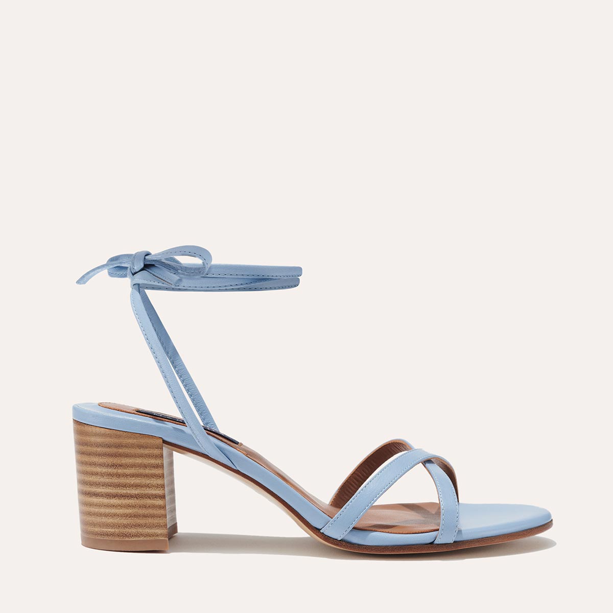 Margaux's strappy Soho Sandal with ankle ties, made in Spain from soft, blue Italian nappa leather