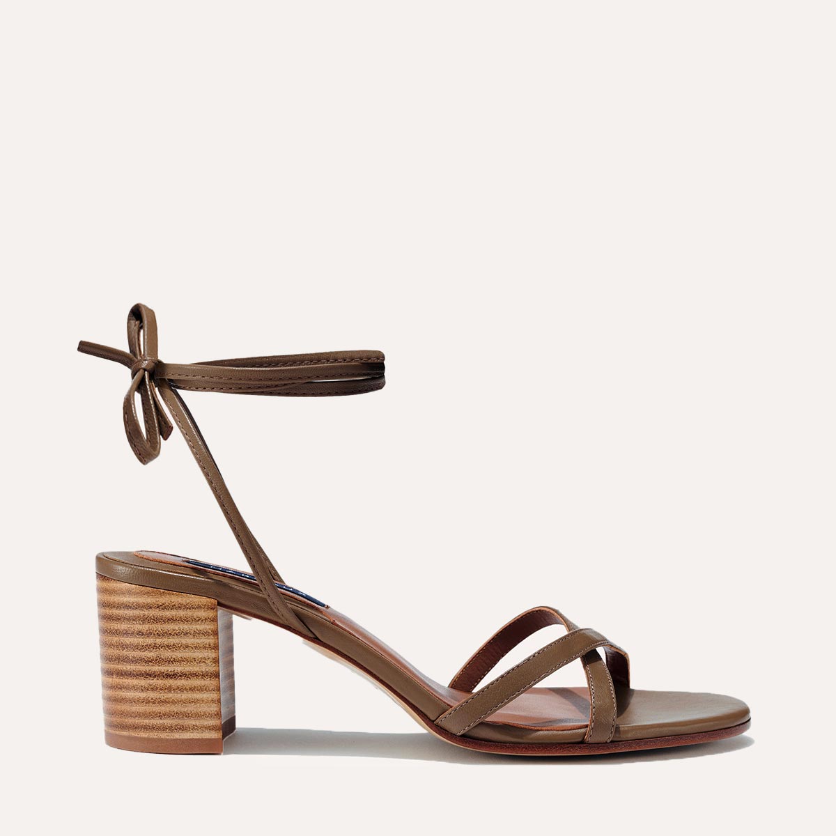Margaux's strappy Soho Sandal with ankle ties, made in Spain from soft, olive brown Italian nappa leather