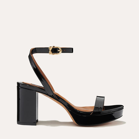 Margaux's classic and comfortable Stella Platform in shiny black patent leather with a perfectly placed strap and a walkable block heel