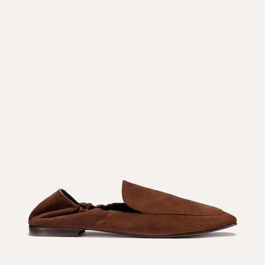The Studio Loafer - Ganache Suede by Margaux, a single pointed-toe brown suede loafer featuring a soft, ruched heel, is shown in side profile against a plain light background.