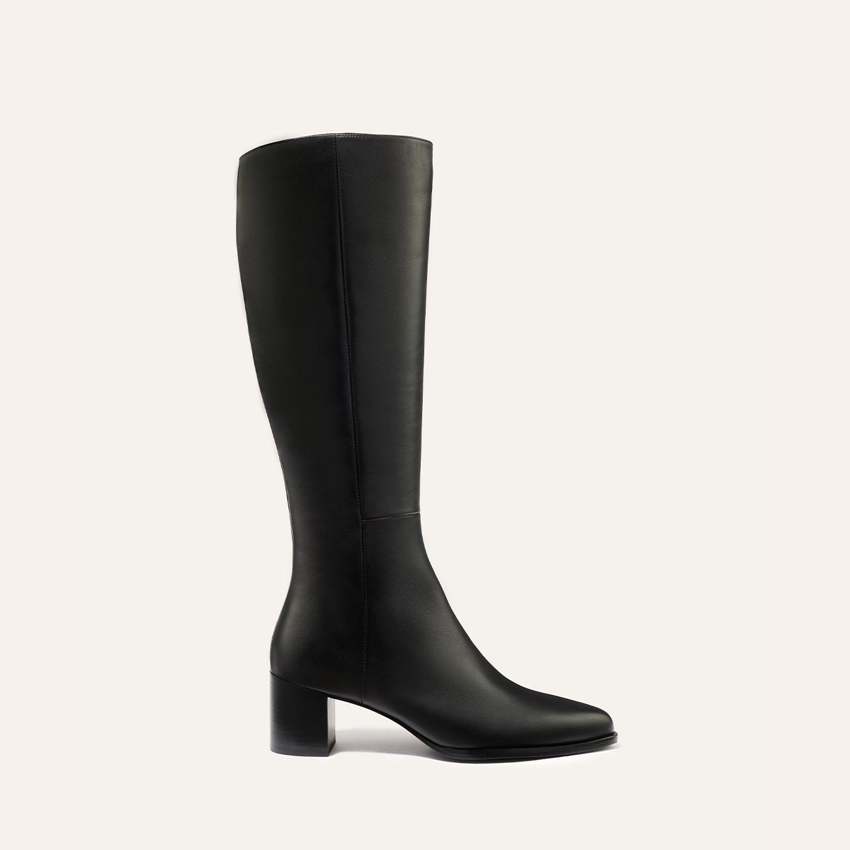 The Uptown Boot - Black Calf by margaux-development is a black knee-high leather boot with a round toe and chunky mid-height heel, shown against a plain light background.