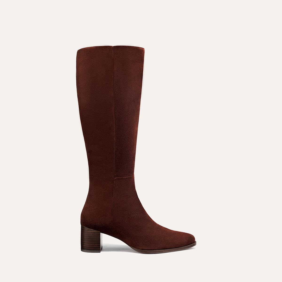 The Uptown Boot - Chocolate Suede by margaux-development: a single brown knee-high suede boot with a rounded toe and low block heel, shown on a plain light background—ideal for fans of the brand’s bestselling ankle boot wanting more coverage.
