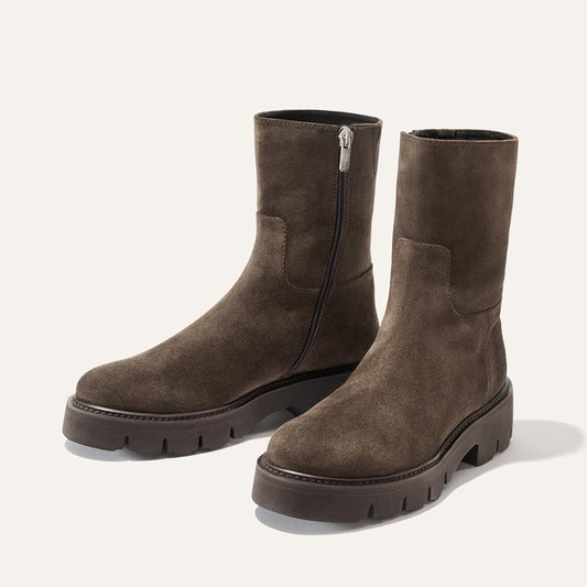 The Wells Boot - English Brown Suede mid-calf boots feature a side zipper and a chunky lugged sole.