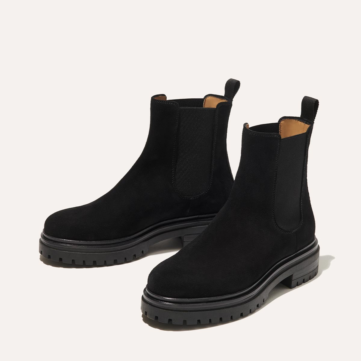 The West Chelsea Boot in Black Suede, featuring water-resistant suede with a rubber lug sole for added traction and versatility.