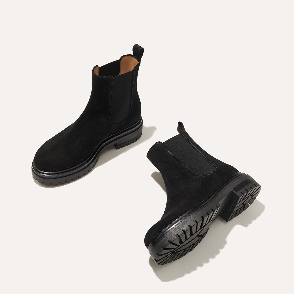 The West Chelsea Boot in Black Suede, featuring water-resistant suede with a rubber lug sole for added traction and versatility.