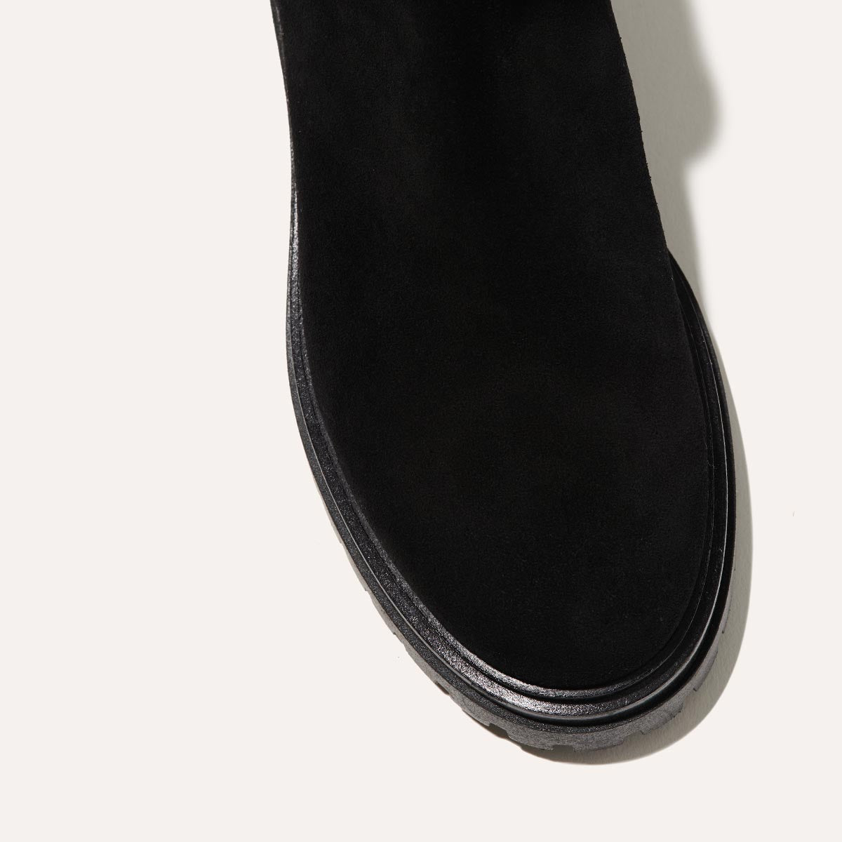 The West Chelsea Boot in Black Suede, featuring water-resistant suede with a rubber lug sole for added traction and versatility.