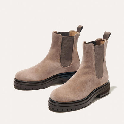The West Chelsea Boot in Sandstone Suede, featuring water-resistant suede with a rubber lug sole for added traction and versatility.
