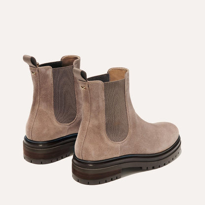 The West Chelsea Boot in Sandstone Suede, featuring water-resistant suede with a rubber lug sole for added traction and versatility.