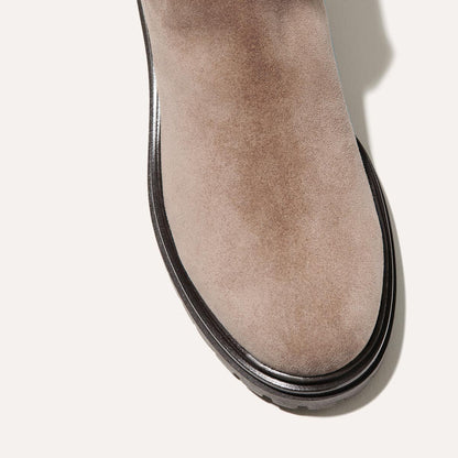 The West Chelsea Boot in Sandstone Suede, featuring water-resistant suede with a rubber lug sole for added traction and versatility.