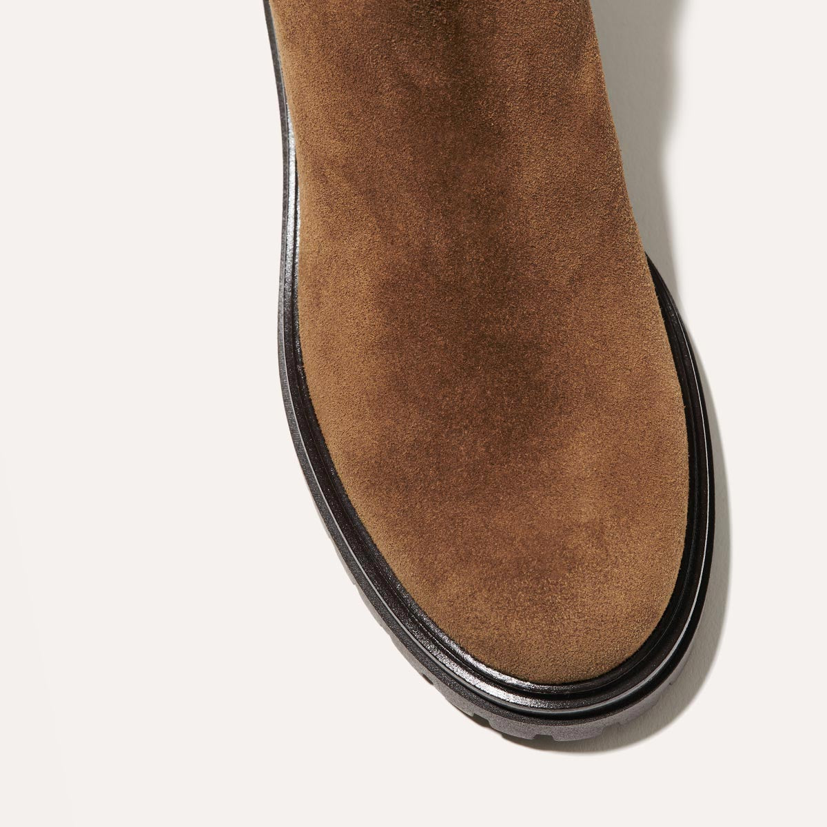 The West Chelsea Boot in Cedar Suede, featuring water-resistant suede with a rubber lug sole for added traction and versatility.