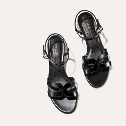 Low heeled sandals shown in black leather