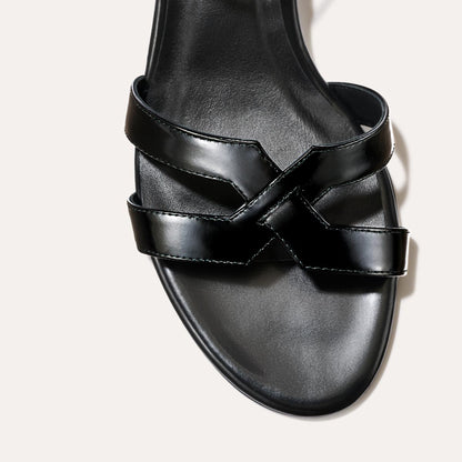 Low heeled sandals shown in black leather
