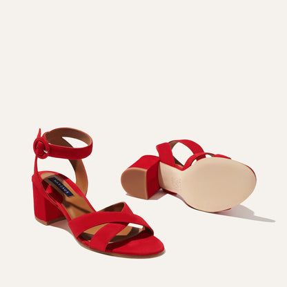 The City Sandal - Poppy Suede by margaux-development: red suede block heels with ankle straps, round buckles, and cushioned insoles. One sandal displays the top and side; the other shows the sole.