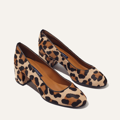The Heel - Tan Leopard Haircalf by Margaux: women's block-heeled shoes in a tan and black leopard print, shown on a light background.