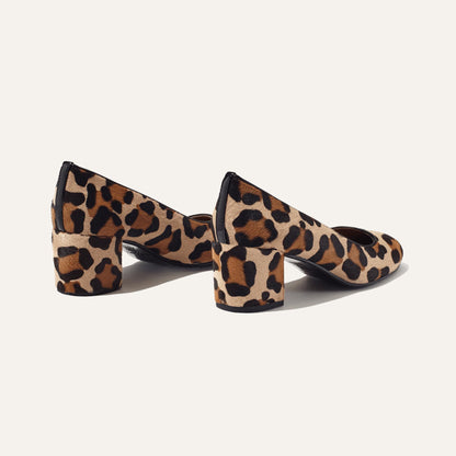 The Heel - Tan Leopard Haircalf by Margaux: a pair of women’s block heel shoes in brown and black leopard print, shown on a plain white background.