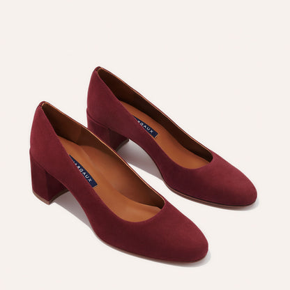 The Heel in Burgundy Suede, a classic block heel featuring a sleek almond toe design complemented by a comfortable 2.5-inch heel.