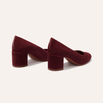 The Heel in Burgundy Suede, a classic block heel featuring a sleek almond toe design complemented by a comfortable 2.5-inch heel.