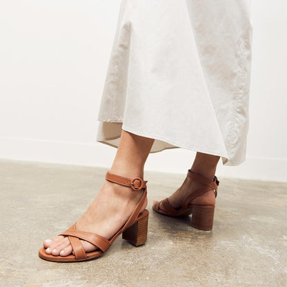The City Sandal in Saddle Nappa, featuring carefully placed straps, and adjustable ankle strap and a comfortable 2.5-inch block heel.