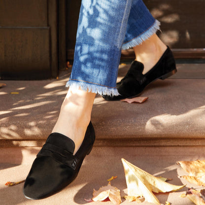 The Penny Loafer in Black Suede, featuring an ultra-luxe Italian suede upper with an unlined construction for a glove-like fit.