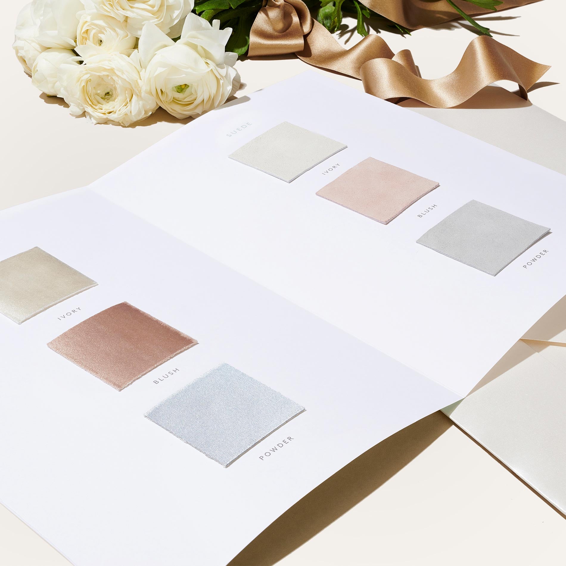 Booklet of fabric and leather swatches for designing custom Margaux bridal shoes