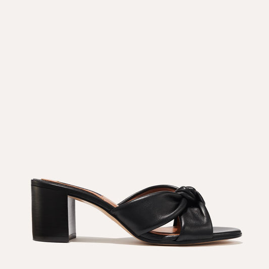 Margaux's Carmine Mule in black nappa leather with a knot detail and comfortable block heel