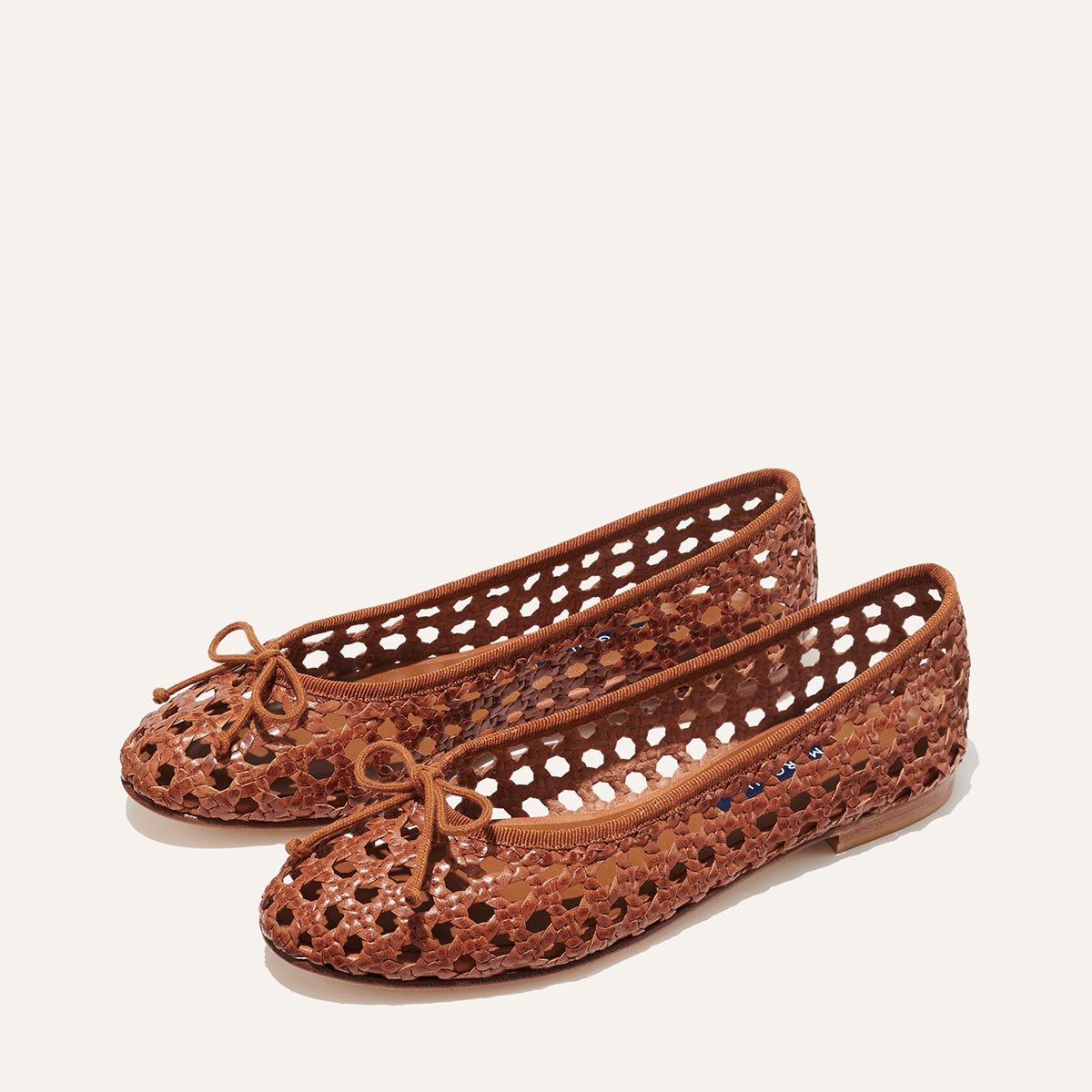 Margaux's classic and comfortable Demi ballet flat, handwoven in India from soft saddle brown leather and finished in Spain