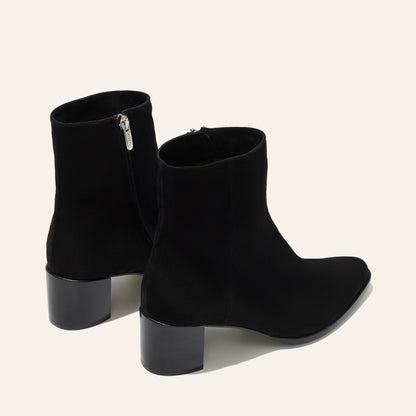The Downtown Boot in Black Suede, a chic ankle-height design complete with a Western-inspired welt and a comfortable 2.5-inch stacked heel.
