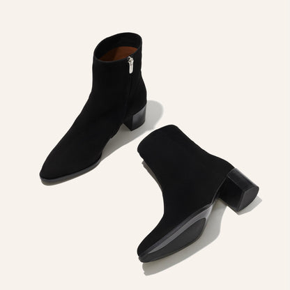 The Downtown Boot in Black Suede, a chic ankle-height design complete with a Western-inspired welt and a comfortable 2.5-inch stacked heel.