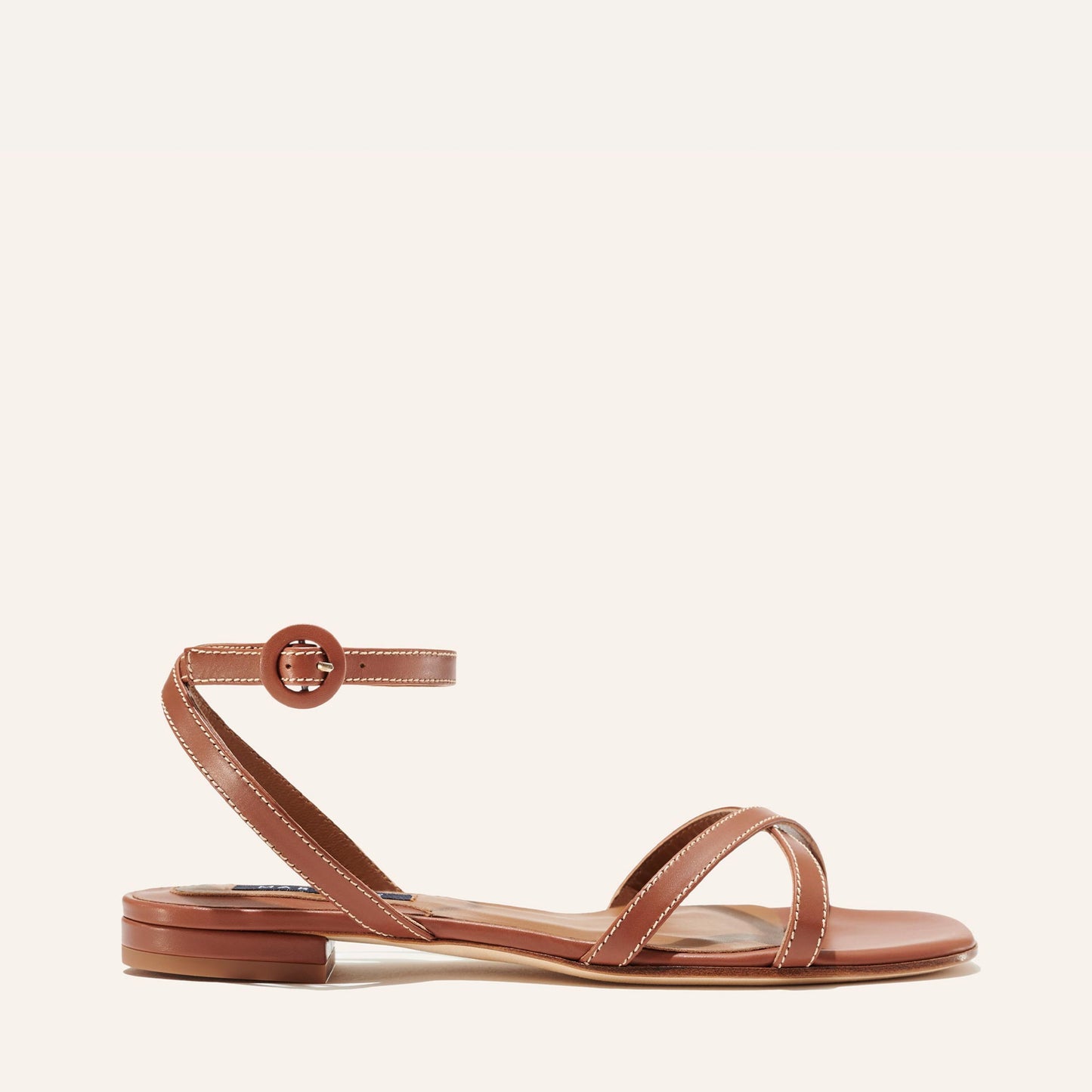 Margaux's classic and comfortable Flat Sandal, made in Spain from soft, saddle brown Italian nappa leather